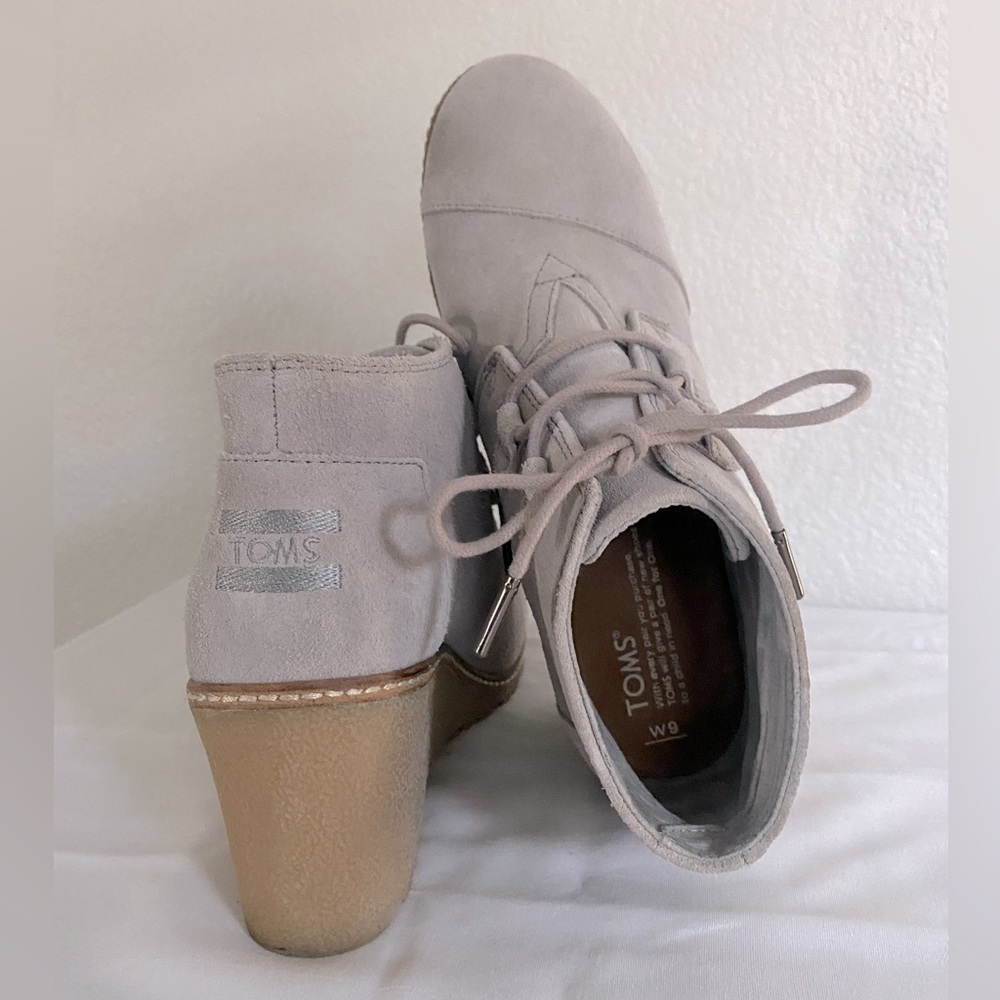 TOMS lace up wedge bootie. Light gray suede with natural heel.